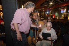 Philip Morris, CEO of Proctors Collaborative congratulates longtime Capital Region jazz historian Tim Coakley during Jazz on Jay in Robb Alley at Proctors in Schenectady on June 26, 2025. Photo by Kevin Montano for Proctors Collaborative.